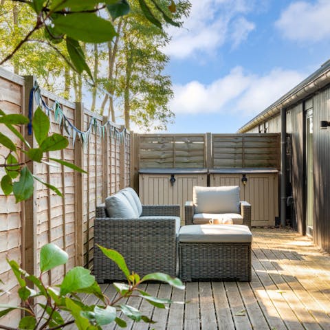 Enjoy a cup of coffee on your private decked area, reached via the bedrooms
