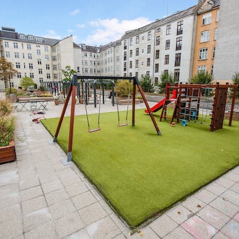 Take the little ones out to the children's playground in the courtyard 