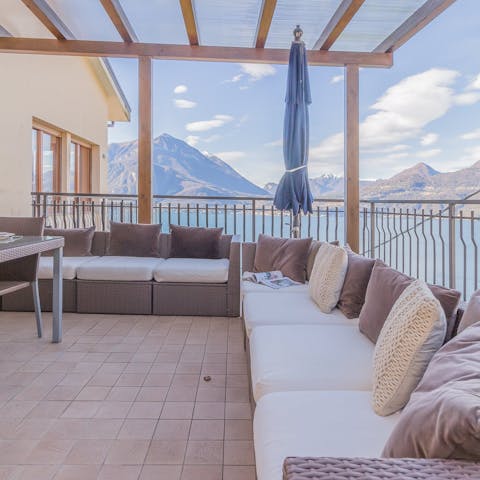 Take in the view of Lake Como flanked by mountains from the private terrace