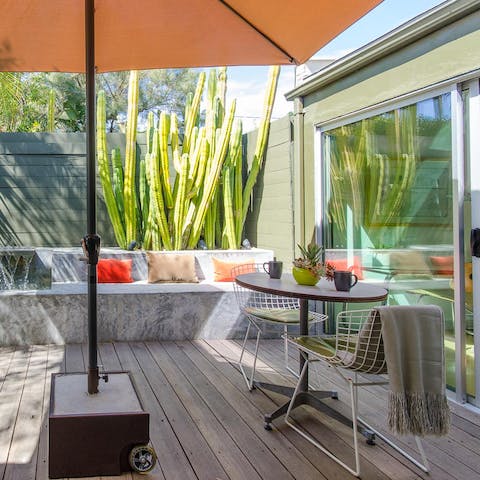 Make the most of indoor-outdoor living in the home's pretty garden