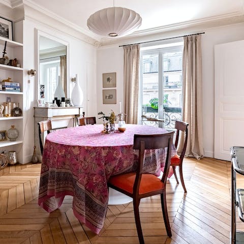 Share a family breakfast of pastries and coffee at the dining table 