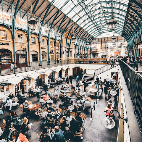 Discover Covent Garden's covered former flower market, lined with shops and restaurants