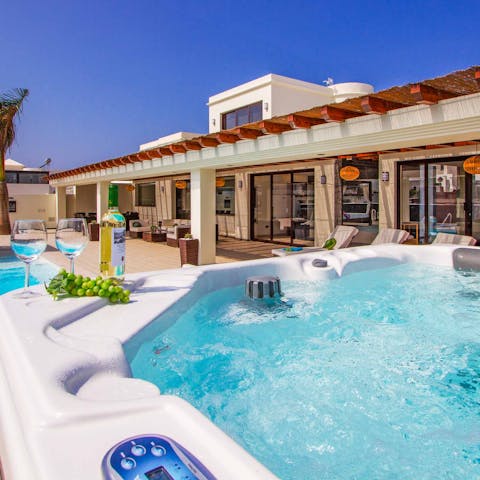 Unwind with a glass of Spanish wine in the jacuzzi hot tub