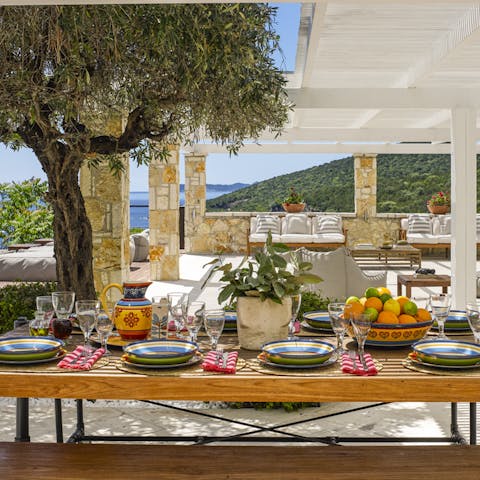 Indulge in family feasts under the shade of the olive tree