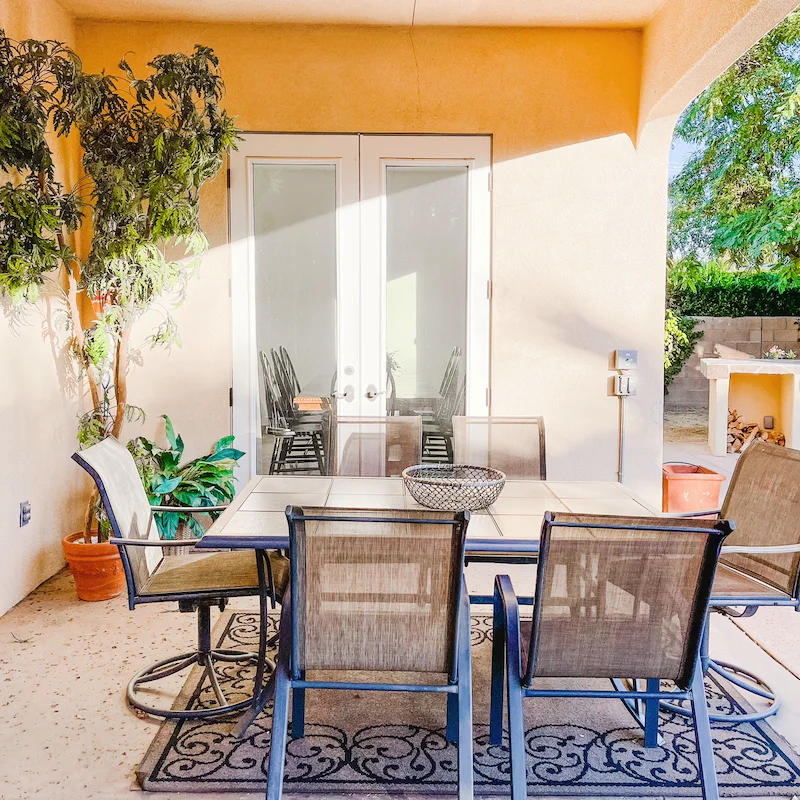 Escape the sun and share a bottle of wine around the covered outdoor table