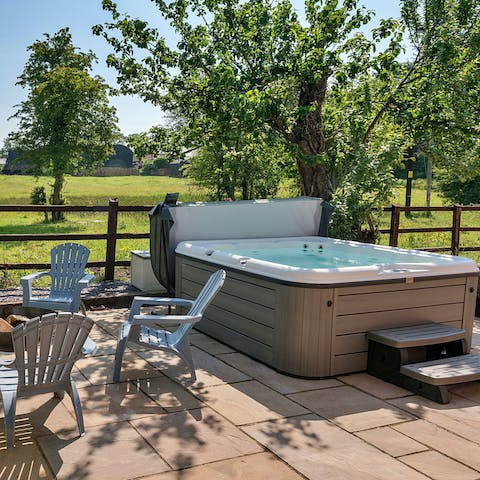 Unwind in the hot tub – the garden is lovely