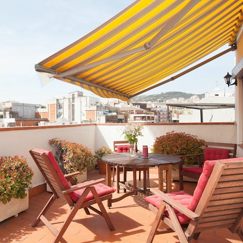 Dine on the sunny terrace with views over the city