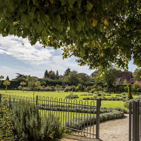 Wander through the two acres of lawns and gardens 
