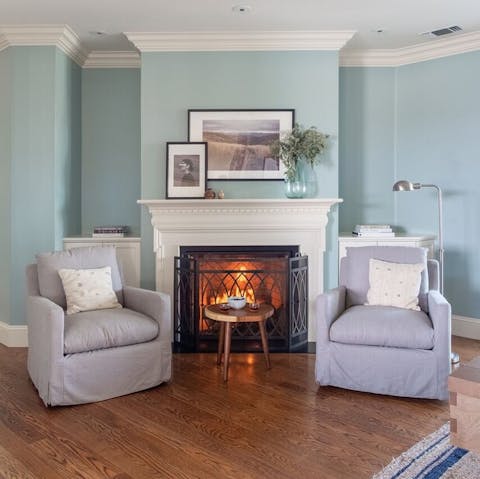 Cosy up in front of the fireplace during the cooler months