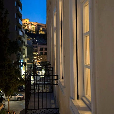 Step out onto the small balcony and gaze at the Acropolis in the distance