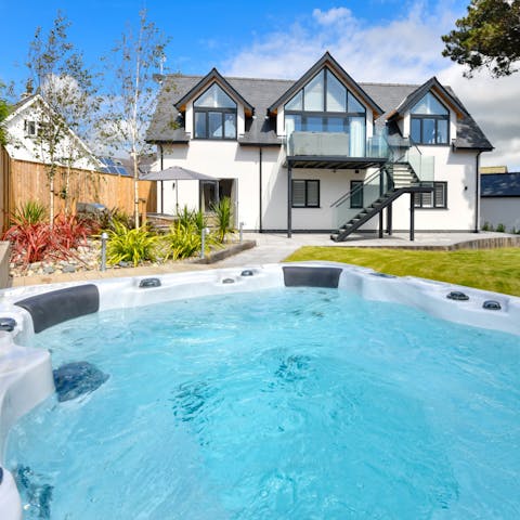 Take a dip in the hot tub at the bottom of the garden