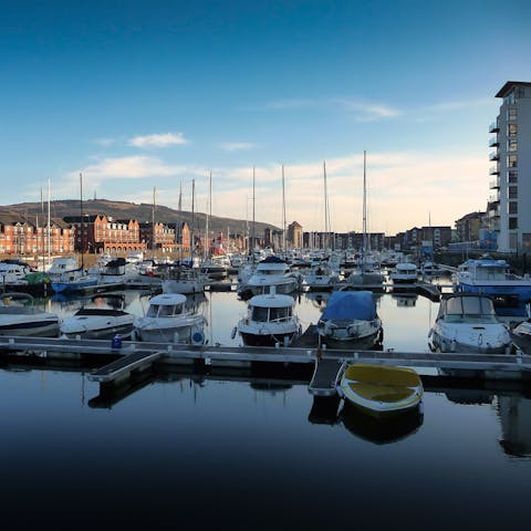 Head into Swansea, a fifteen-minute drive away, and stroll around the marina 