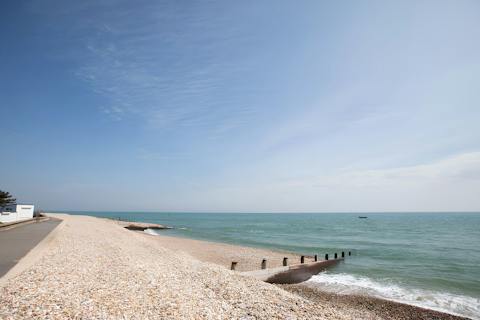Stroll along the pebbles of East Beach, just footsteps away