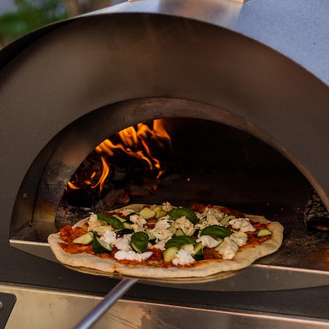 Prepare a hearty feast on the pizza oven