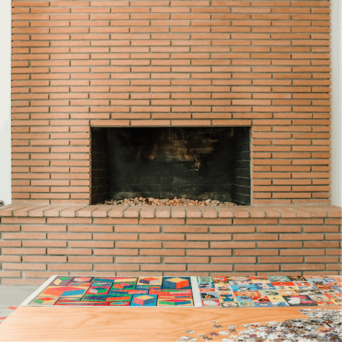 Get cosy by the warming fireplace
