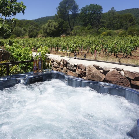 Hop into the hot tub with vineyard views