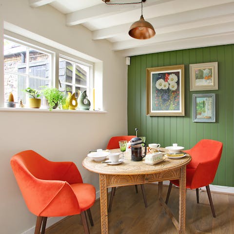 Gather for a family meal or host a game night around the charming dining table 