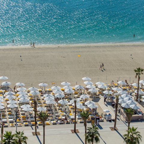 Sunbathe on a private and serviced beach after driving to see the sights