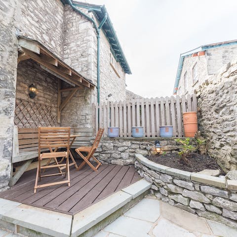 Bask in the late summer sunshine in the home's private courtyard