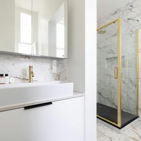 Get ready in the marble-style bathroom for an evening out in London