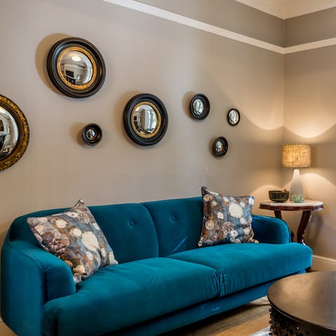 Unwind on the plush sofa with a cup of tea after a day of exploring