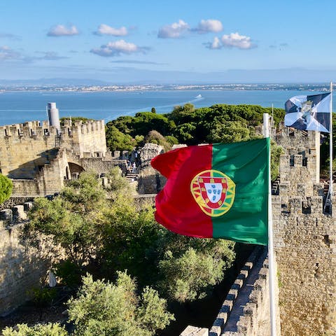 Visit the 8th-century Castelo de São Jorge, easily reached by foot or public transport