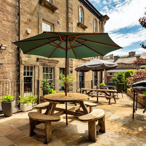 Sit and chat under umbrellas on the shared terrace