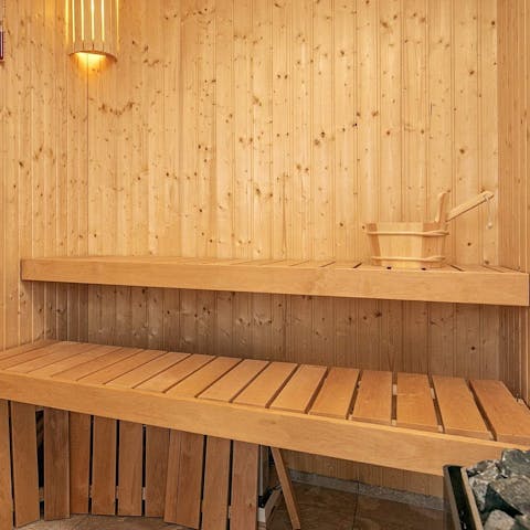 Relax in the luxurious wooden sauna 