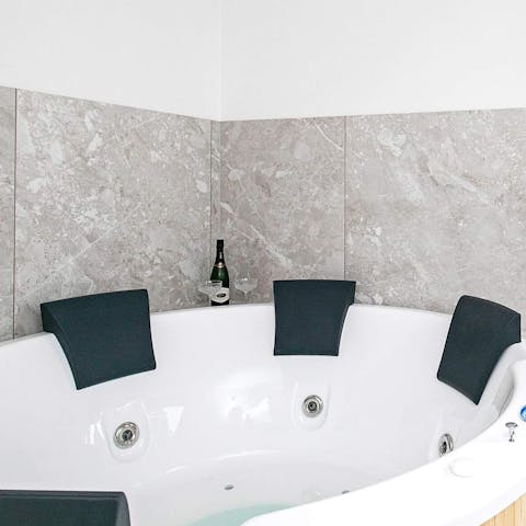 Enjoy a glass of champagne while soaking in the indoor jacuzzi 