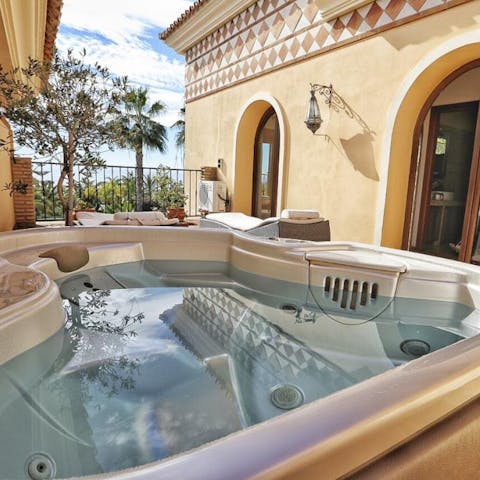 Step onto the balcony of the master bedroom and relax in the calming Jacuzzi bubbles