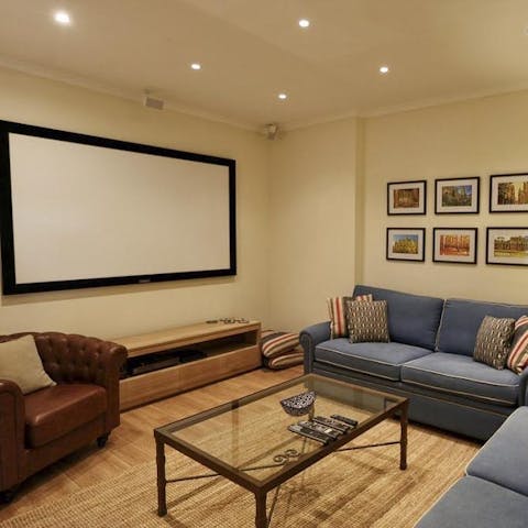 Cuddle up in the cinema room and experience your favourite films on the big screen