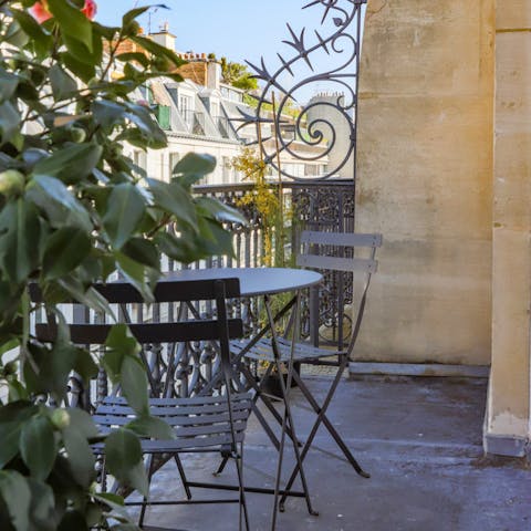 Relax on the terrace with its Parisian rooftop views