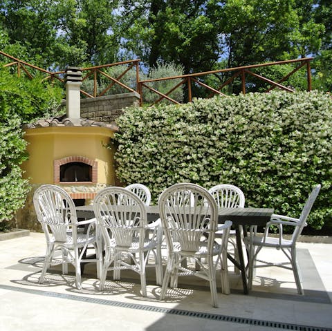 Bake pizzas in the fire-wood oven for alfresco lunches