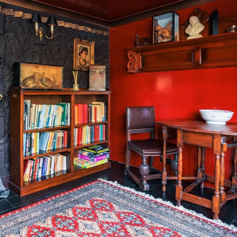 Admire the host's selection of books on the shelf in the living space