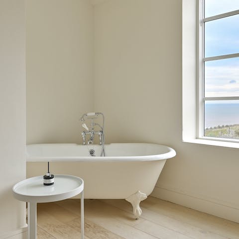 Unwind after a long day with a relaxing soak in the sumptuous bathtub