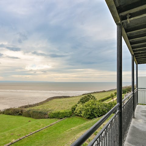 Watch the sunset over the ocean on the balcony, a glass of wine in hand