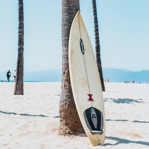 Spend the morning catching waves – there's on-site surfboard and wetsuit storage