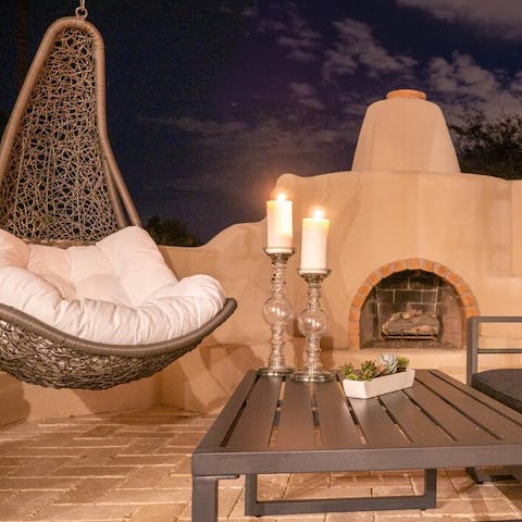 Spend long summer evenings by outdoor fireplace