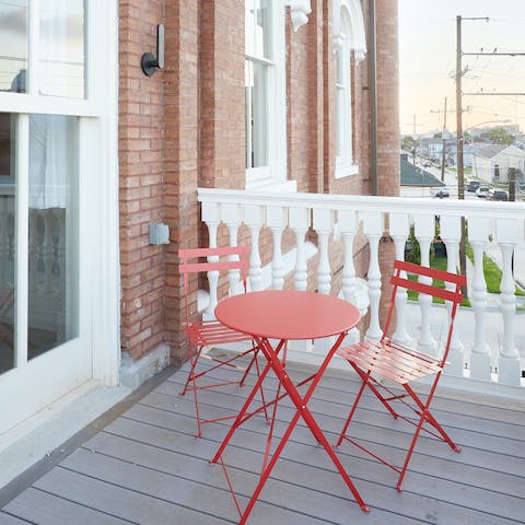 Take your cup of coffee out onto the pretty balcony 