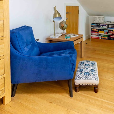 Read a book in the cosy velvet chair