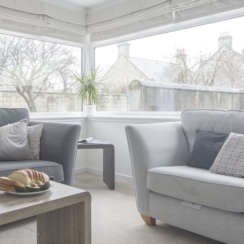 Relax in the south-facing sunroom lounge with a cup of tea