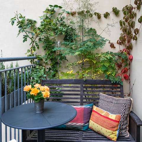 Relax on one of the tranquil balconies surrounded by plants with a glass of mjød