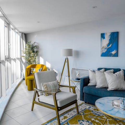 Relax in the bright living space offering panoramic views