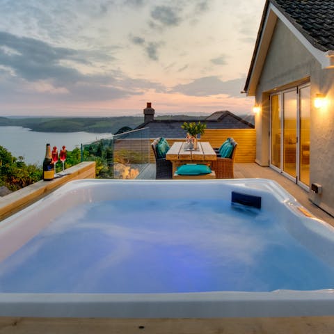 Bubble away the stress in a hot tub offering idyllic sea views
