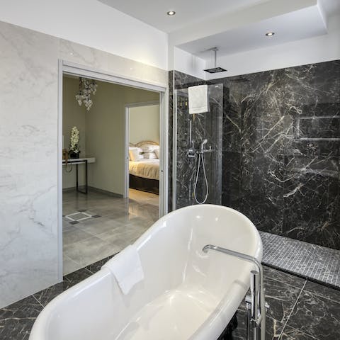 Unwind in the luxury marble bathroom