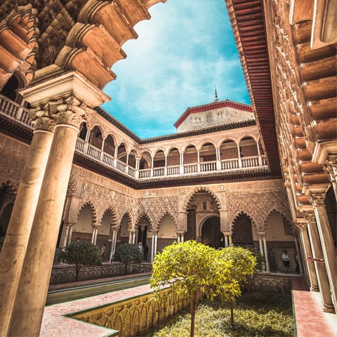 Pay a visit to the impressive Alcázar of Seville, only ten minutes' walk away