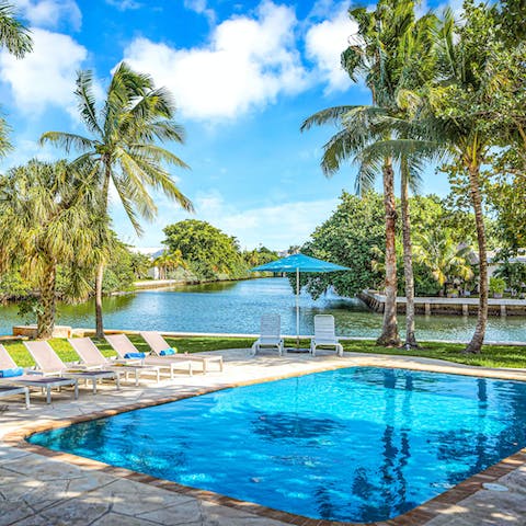 Cool off in the private swimming pool by the waterside