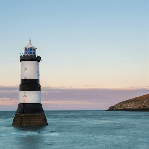 Explore the idyllic Isle of Anglesey and its famously beautiful coastline, villages, hiking trails, and thrilling watersports