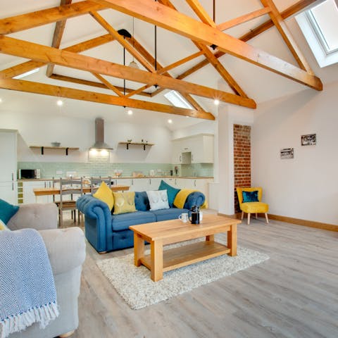 Relax beneath the charming woodbeams of a former barn