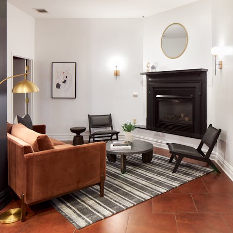 Relax in front of the fireplace in the building's cosy lounge area